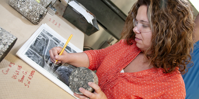Lori Greer documenting pavement details on a intersection