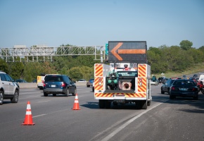 Motorist Assist vehicle on the side of the road with arrow pointing left