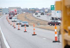 Work zone with traffic and orange cones